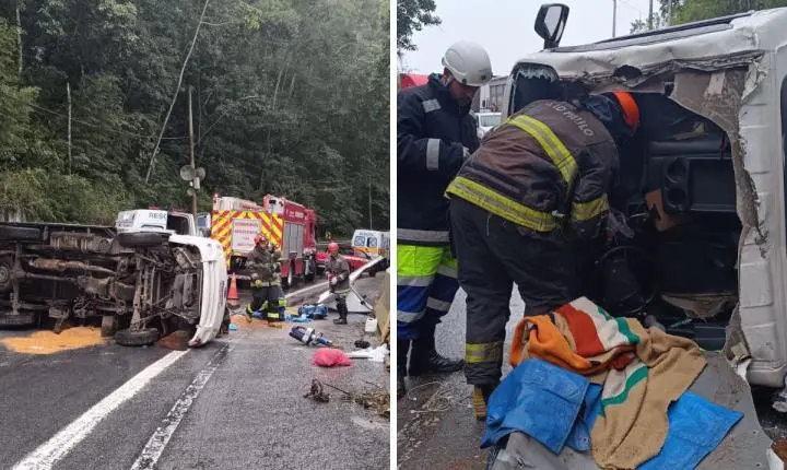 Motorista fica preso às ferragens após caminhão capotar na Rodovia dos Tamoios, em Caraguatatuba